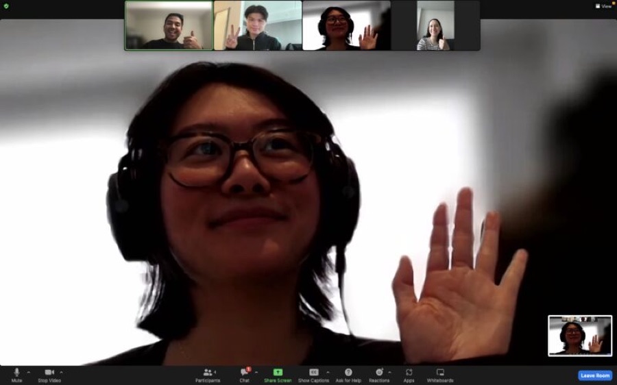 A mentee waving on a video call